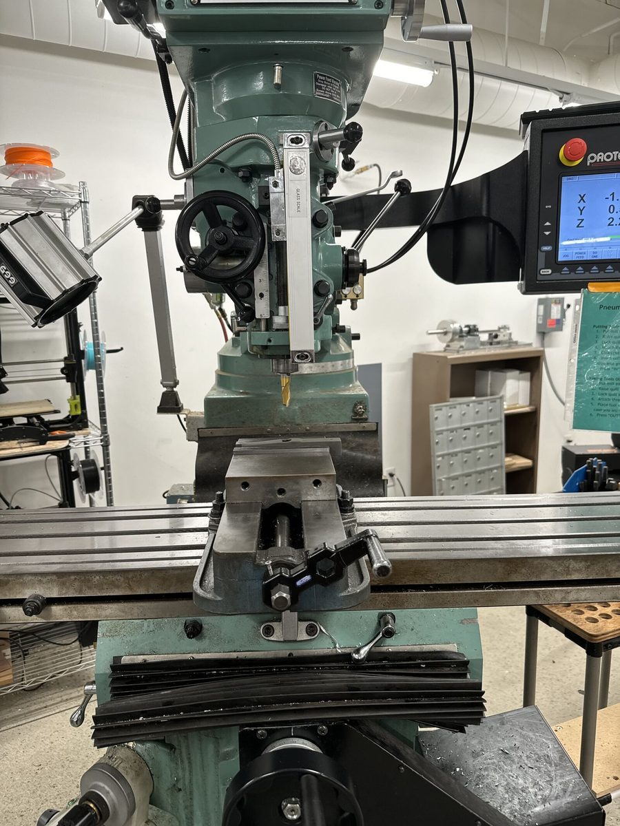 Machining the aluminum mount sleeve.